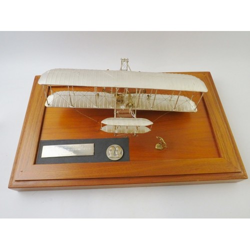 351 - A limited edition sterling silver replica model of the Wright Brothers aeroplane 'Flyer' produced by... 