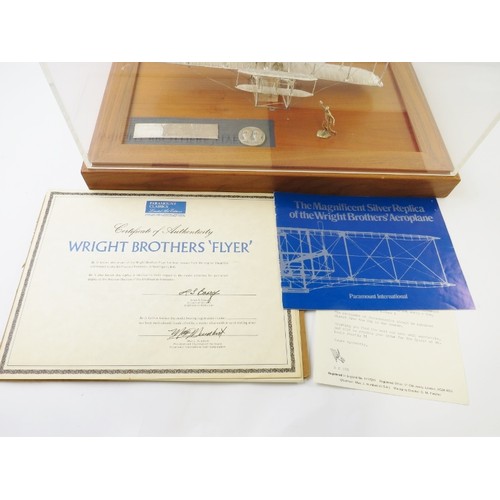 351 - A limited edition sterling silver replica model of the Wright Brothers aeroplane 'Flyer' produced by... 