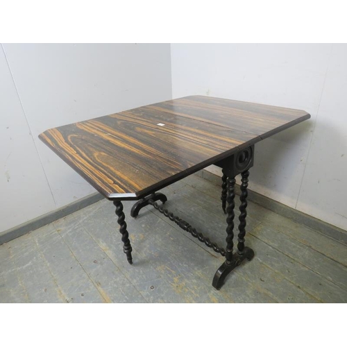 702 - A 19th century coromandel Sutherland table, the ebonised base with twin barley-twist supports joined... 