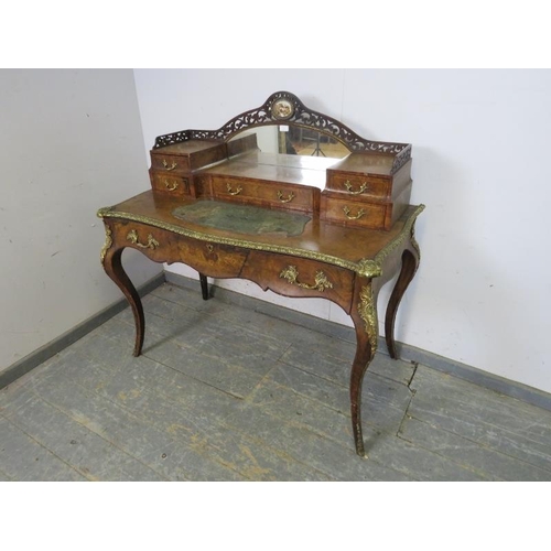 704 - A good 19th century French burr walnut, gilt metal mounted writing desk, the upper gallery with mirr... 