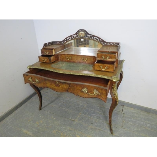 704 - A good 19th century French burr walnut, gilt metal mounted writing desk, the upper gallery with mirr... 