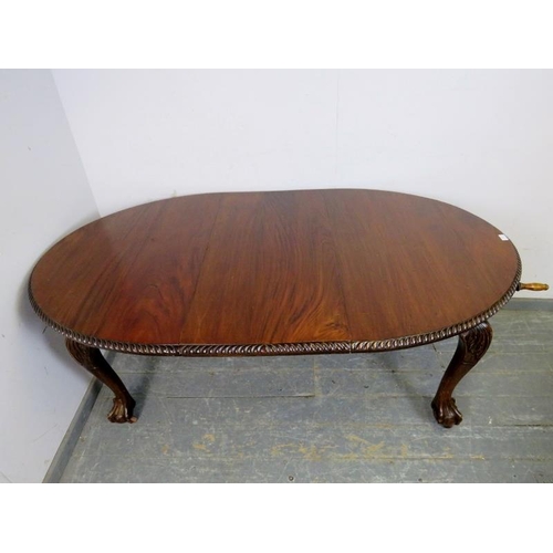 705 - A Victorian mahogany oval wind-out extending dining table by Joseph Fitter, the top with gadrooned e... 