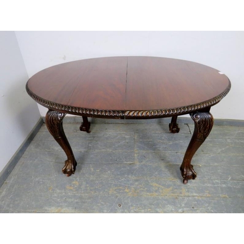 705 - A Victorian mahogany oval wind-out extending dining table by Joseph Fitter, the top with gadrooned e... 