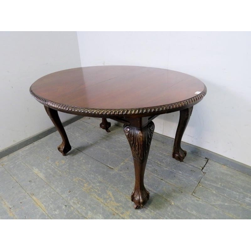 705 - A Victorian mahogany oval wind-out extending dining table by Joseph Fitter, the top with gadrooned e... 