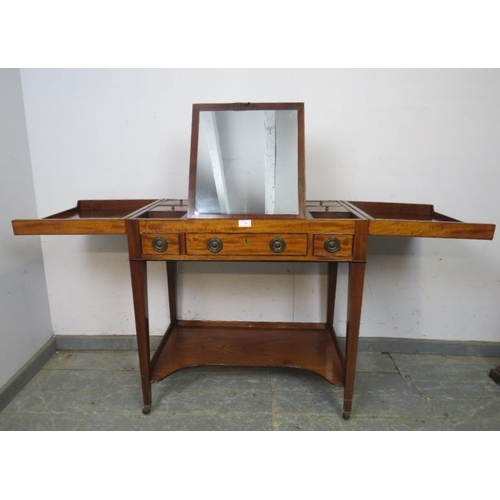 706 - A George III flame mahogany gentleman’s vanity, the hinged top opening to reveal a fitted interior, ... 