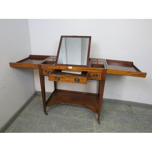 706 - A George III flame mahogany gentleman’s vanity, the hinged top opening to reveal a fitted interior, ... 