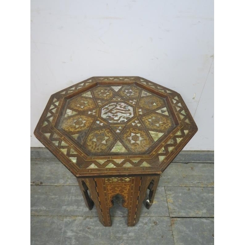 708 - An antique Anglo-Indian octagonal table, profusely decorated with inlaid specimen woods and mother o... 