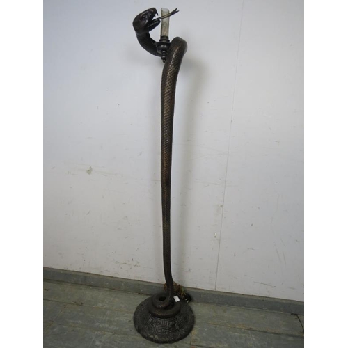 711 - A bronze floor lamp after Edgar Brandt, modelled as a coiled snake. 
H153 x Diameter 31cms (approx)
... 