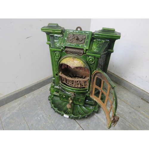 713 - An antique French green enamel inset multi-fuel stove. 
H59 x W53 x D44cms (approx)
Condition report... 