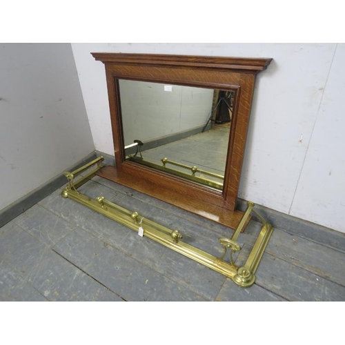 723 - An Arts & Crafts Period oak mirror, with moulded cornice and shelf below. Together with an Arts & Cr... 