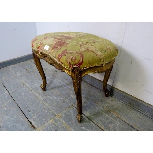 764 - A late 18th/early 19th century French giltwood kidney-shaped dressing stool, retaining the original ... 