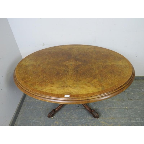 767 - A Victorian burr walnut oval loo table, the cross-banded top with marquetry inlay, on a cluster colu... 