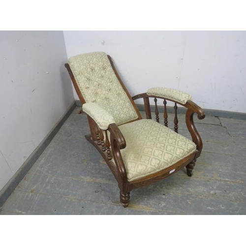 774 - A Victorian oak open-sided armchair with reclining mechanism, reupholstered in good quality buttoned... 