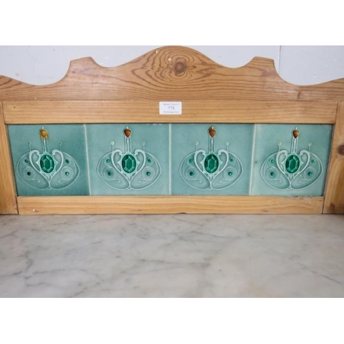 775 - An antique pine washstand, the rear gallery with inset Art Nouveau mint green tiles, above a white m... 