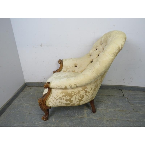 780 - A Victorian walnut button-backed armchair, reupholstered in cream damask, on scrolled supports. 
H91... 