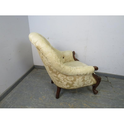 780 - A Victorian walnut button-backed armchair, reupholstered in cream damask, on scrolled supports. 
H91... 