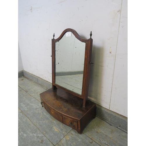 785 - A George III mahogany swing vanity mirror, retaining the original mottled plate the bow-fronted box ... 