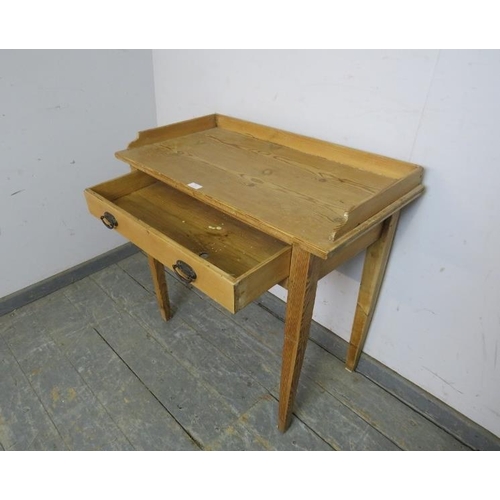 791 - An antique pine Continental washstand, the ¾ gallery above one long drawer with pressed brass handle... 