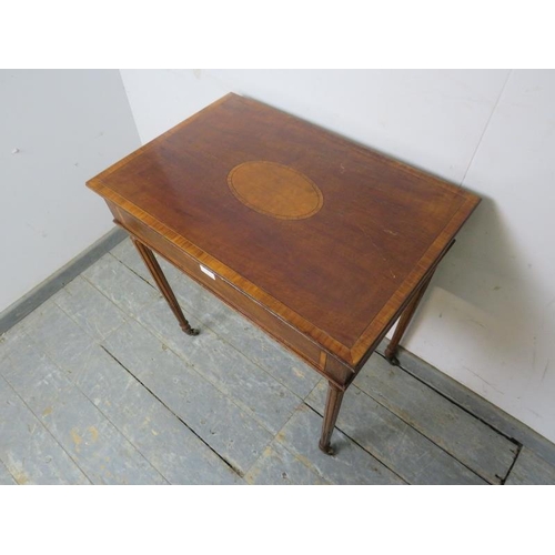 795 - An Edwardian mahogany side table, having satinwood central panel and crossbanded inlay, housing one ... 