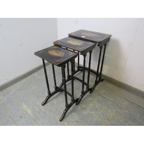 796 - A set of three Japanese black and gold lacquered nesting tables, hand painted with traditional scene... 