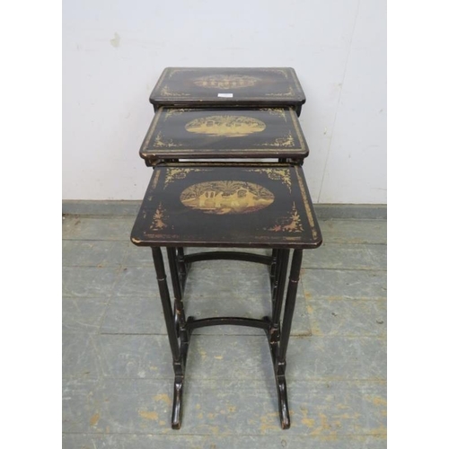 796 - A set of three Japanese black and gold lacquered nesting tables, hand painted with traditional scene... 