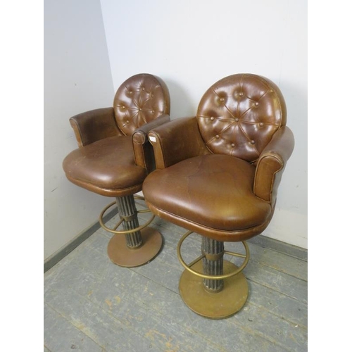 798 - A pair of good quality bar stools, upholstered in soft brown buttoned leather, on fluted oak pedesta... 