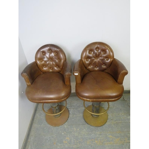 798 - A pair of good quality bar stools, upholstered in soft brown buttoned leather, on fluted oak pedesta... 