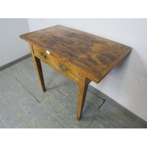 813 - An unusual country elm side table, housing one long drawer with pierced brass ‘batwing’ handles on t... 