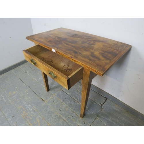 813 - An unusual country elm side table, housing one long drawer with pierced brass ‘batwing’ handles on t... 