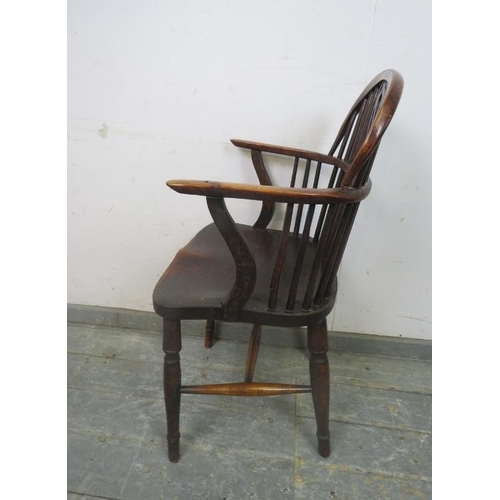 816 - A 19th century elm and yew wood Windsor armchair, having shaped and pierced splat, on turned support... 