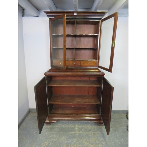 822 - A George III mahogany apothecarists cabinet, the glazed top section with fitted shelves retaining in... 