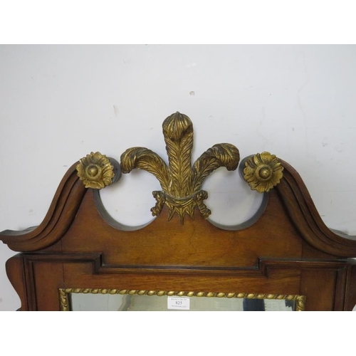 825 - An antique Georgian Revival wall mirror, the broken swan-neck pediment with Prince of Wales feather ... 