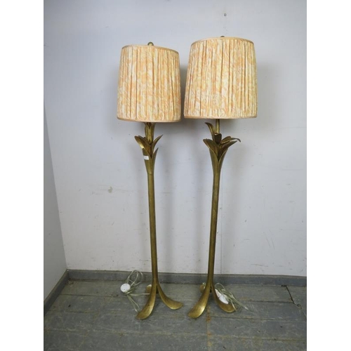 828 - A pair of gilt metal floor lamps, the naturalistic columns on splayed tripod supports. Including sha... 