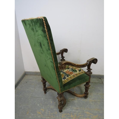 833 - A 19th century Continental fruitwood throne chair, upholstered in green velvet and multi coloured ta... 