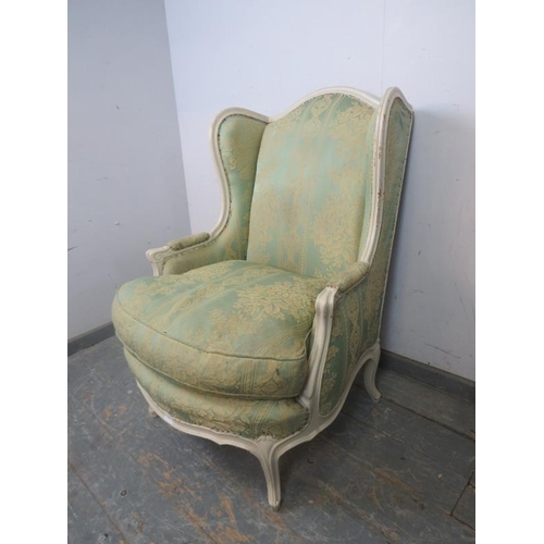 837 - An antique French giltwood wingback armchair, upholstered in pistachio green damask material, on cab... 