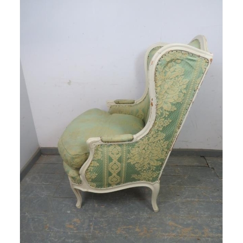 837 - An antique French giltwood wingback armchair, upholstered in pistachio green damask material, on cab... 