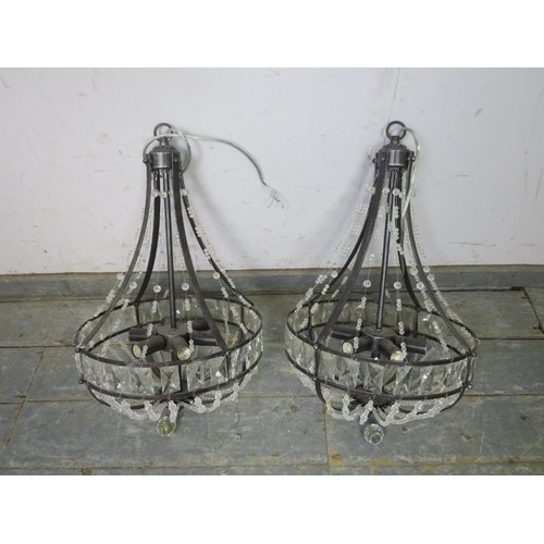 841 - A pair of burnished metal and glass basket chandeliers in the Classical taste, each accepting six sm... 