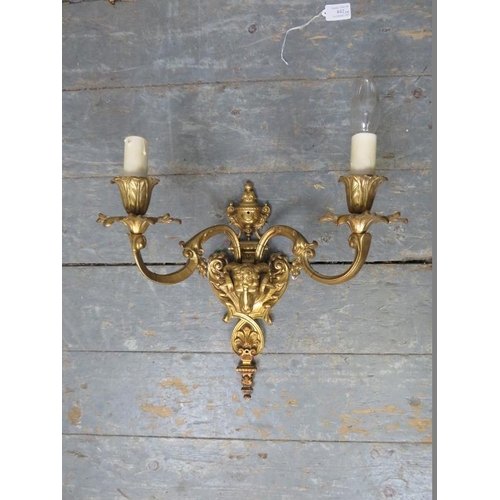 842 - A set of four vintage antique style gilt brass wall sconces, with relief decoration modelled as ram’... 