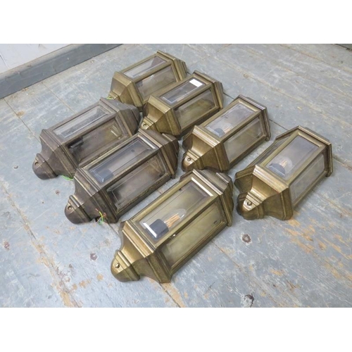 844 - Seven Italian brass wall lights in the Edwardian taste, with bevelled glass pane inserts.
H36cm W17c... 