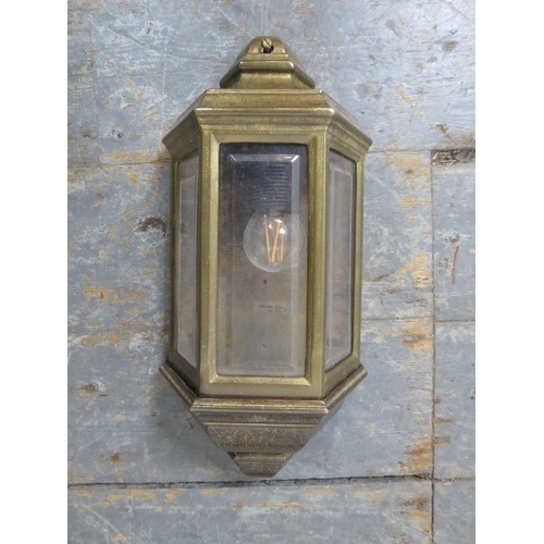 844 - Seven Italian brass wall lights in the Edwardian taste, with bevelled glass pane inserts.
H36cm W17c... 