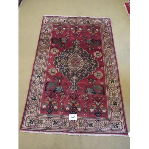 862 - South west Persian Loei rug with a large central motif and stylized animals. 198cm x 135cm approx.
C... 