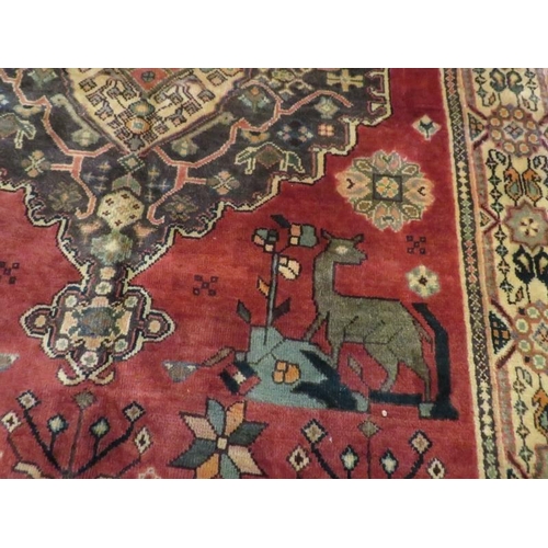 862 - South west Persian Loei rug with a large central motif and stylized animals. 198cm x 135cm approx.
C... 