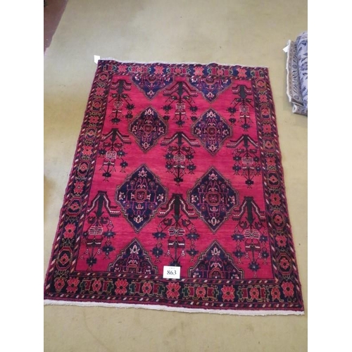 863 - North west Persian Afshar rug with repeat central pattern on red ground. 197cm x 158cm approx.
Condi... 