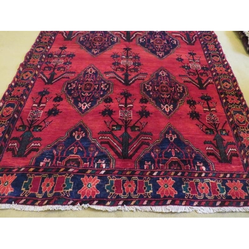 863 - North west Persian Afshar rug with repeat central pattern on red ground. 197cm x 158cm approx.
Condi... 