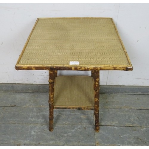 747 - A turn of the century tiger bamboo square two-tier table, with inset sisal covering, on canted suppo... 