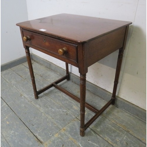 749 - A George IV mahogany side table, housing one long drawer, on ring turned supports with an ‘H’ stretc... 