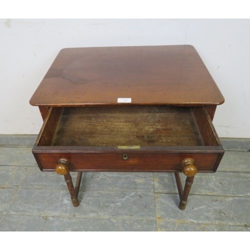 749 - A George IV mahogany side table, housing one long drawer, on ring turned supports with an ‘H’ stretc... 