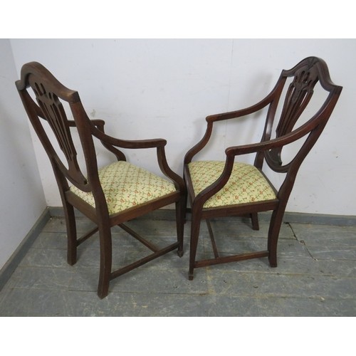 757 - A set of eight (6+2) Georgian Revival mahogany dining chairs in the manner of Hepplewhite, the pierc... 