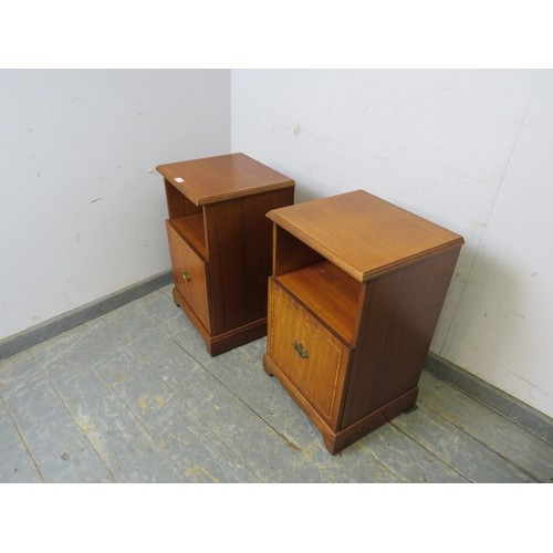 731 - A pair of vintage walnut bedside cabinets by Beithcraft, with open shelves above inlaid cupboards wi... 