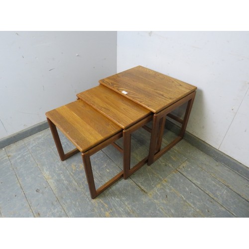 733 - A set of three mid-century ash nesting tables, on rail supports. 
H48cm W54cm D43cm approx.
Conditio... 